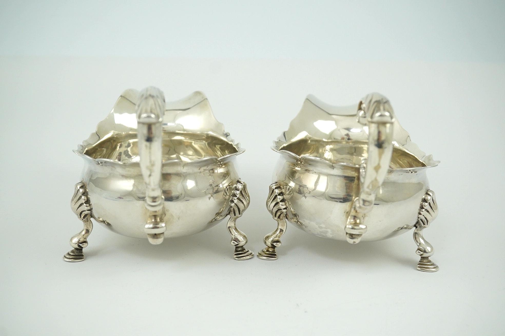 A pair of George II silver sauceboats, by Henry Brind